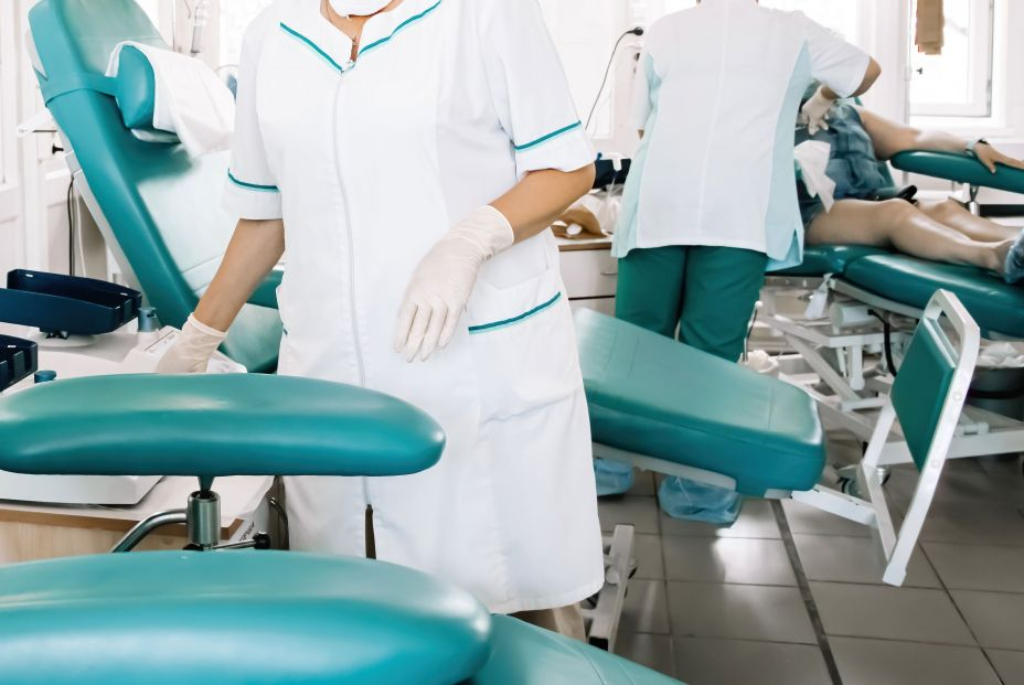 bigstock Nurse Prepares Chair For Blood 457085221