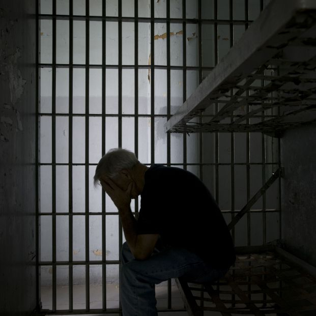 bigstock Jail Head In Hands 1414114