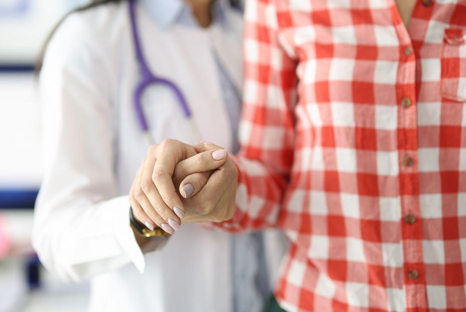 bigstock Doctor Supporting Patient By H 397411385