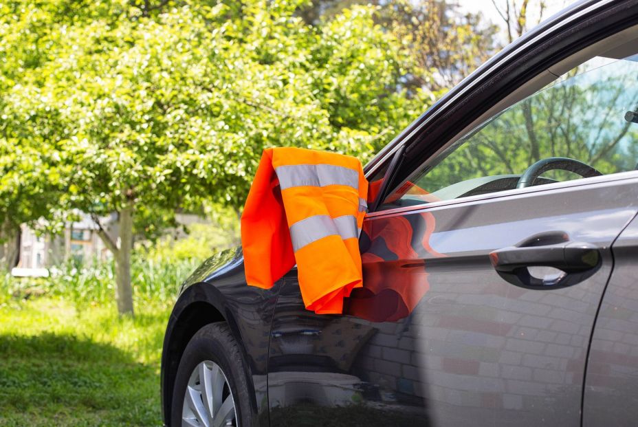 bigstock An Orange Warning Vest Is Hang 454829621