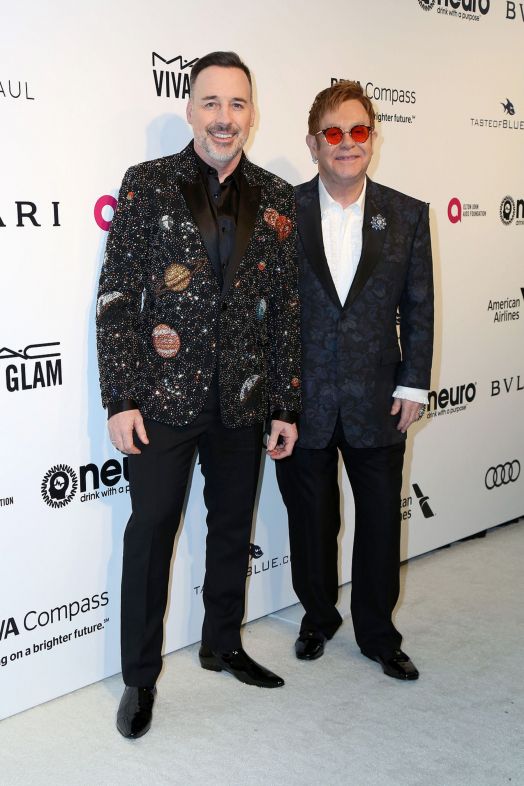 David Furnish y Elton John en la gala 25 de los premios anuales de la Academia Elton John. Fuente: Bigstock