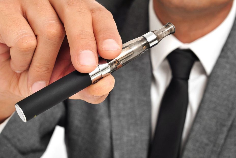 bigstock man wearing a suit vaping with 52117903