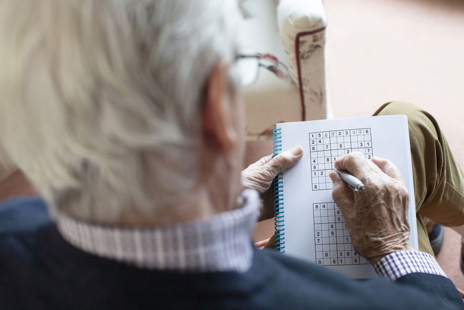 bigstock Senior Man Doing Sudoku Puzzle 331089862